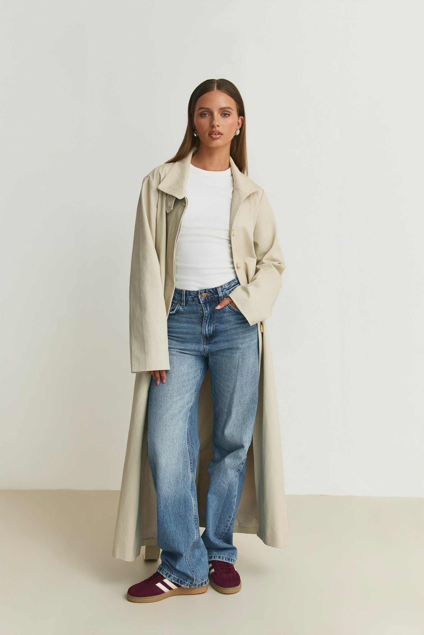 The Capsule Original Trench worn open with jeans