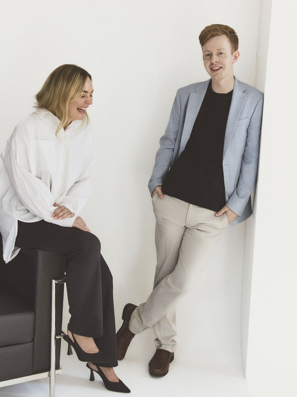 Capsule co-founders wearing the Original Trench
